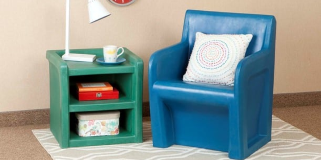 Blue chair and green table next to clock, designed for safety with ligature-resistant features.