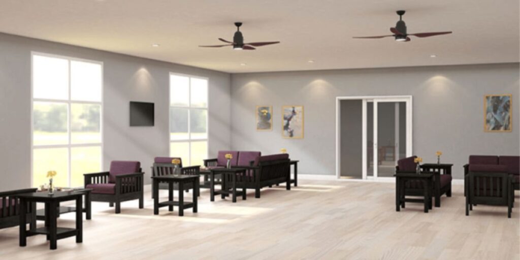 A large room with purple chairs and tables. Seamless surfaces and designs for easy cleaning, reducing infection rates in healthcare settings.