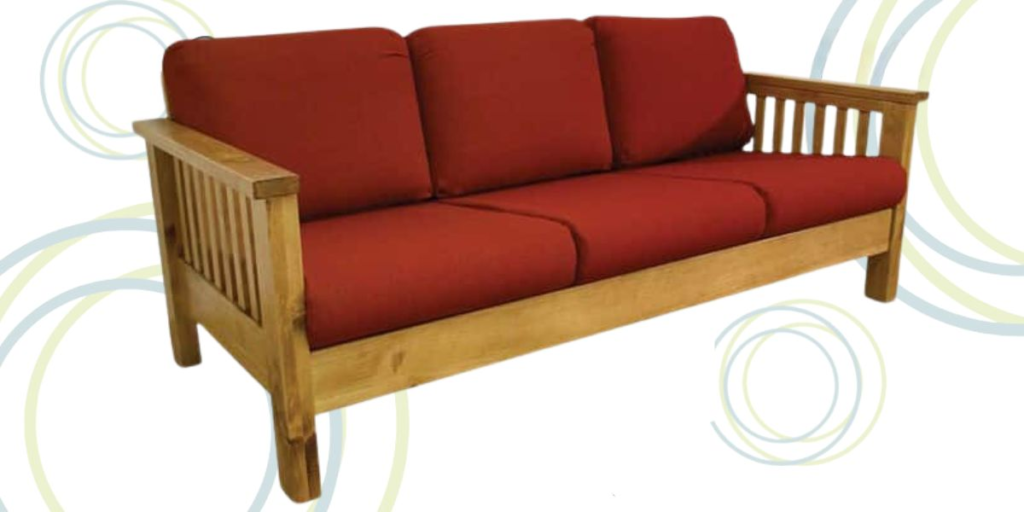 Wooden couch featuring red cushions and a sturdy wooden frame, designed for comfort and support in healthcare environments.