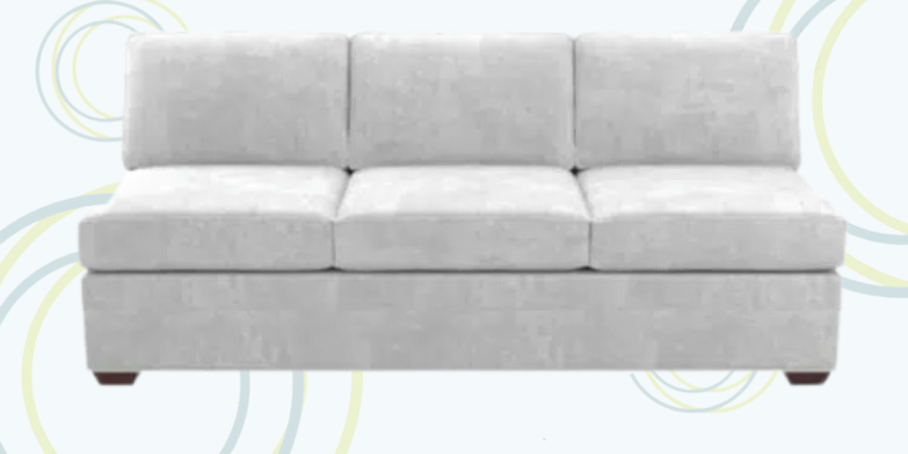 A white couch featuring a circular pattern, designed for versatility as a sleeper in various living environments.