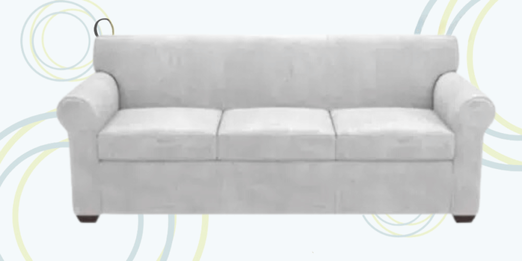 A white couch featuring a circular pattern, designed for both seating and sleeping in practical settings.
