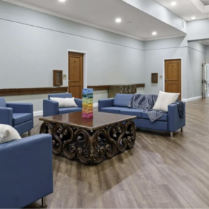Living room at the community center featuring bed bug-proof furniture with sealed seams and smooth corners for pest prevention.