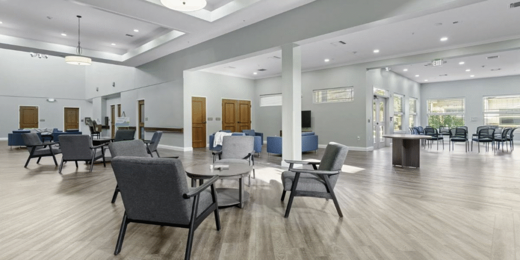 Dining room in a senior living community, featuring durable furniture designed for comfort and long-term use in healthcare settings.