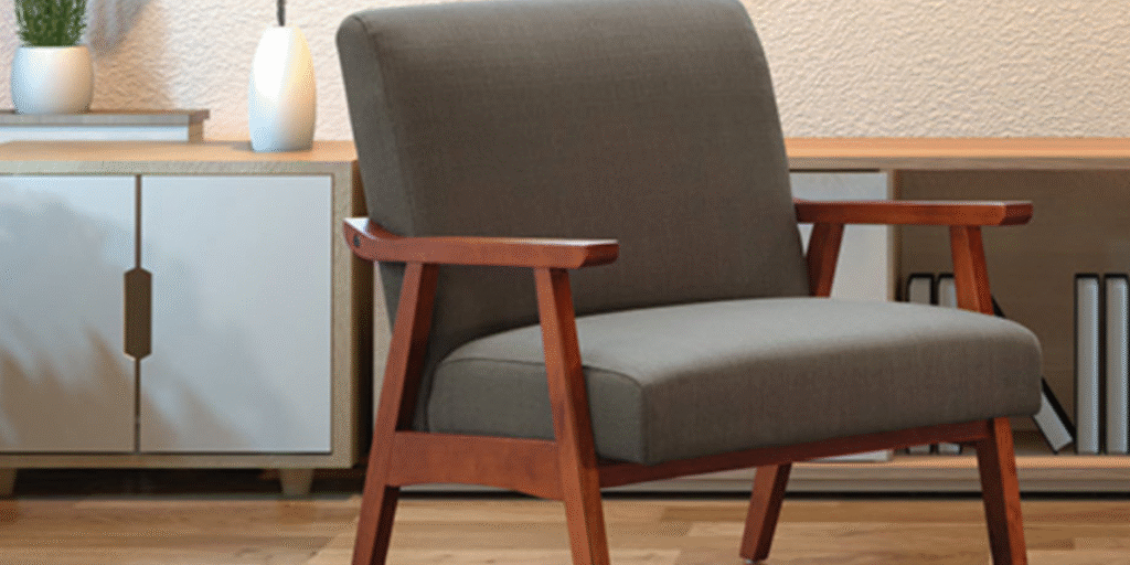 A wooden-framed chair with an upholstered seat, suitable for creating therapeutic zones in a therapist's office.