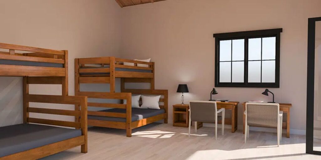 Bunk beds in a room, highlighting their design and potential for space-saving in various settings, including institutional use.